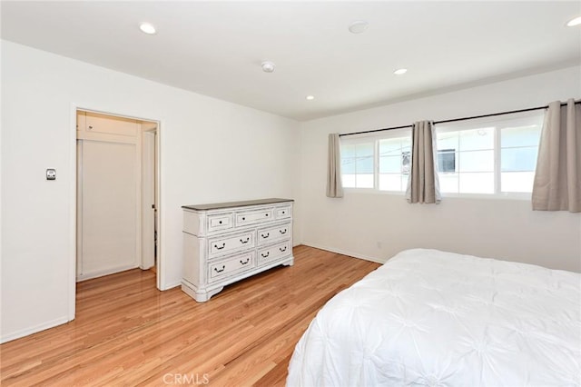 bedroom with light hardwood / wood-style flooring