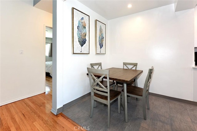 dining area with hardwood / wood-style flooring