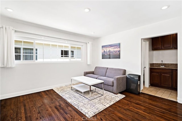 living room with dark wood-type flooring and indoor wet bar