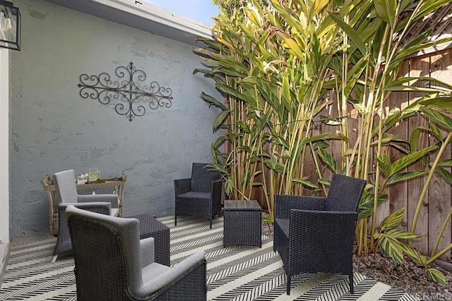 wooden terrace with a patio