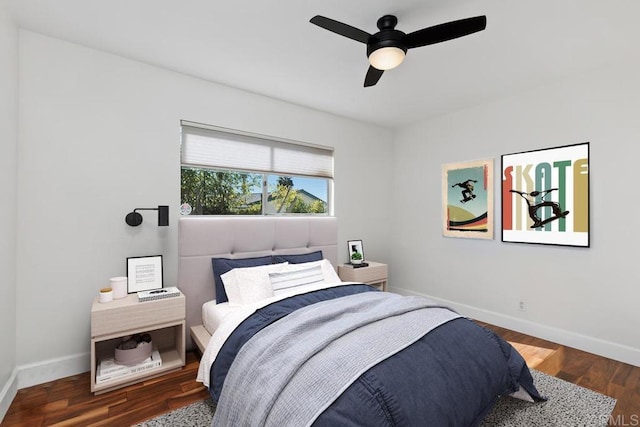 bedroom with ceiling fan and dark hardwood / wood-style flooring