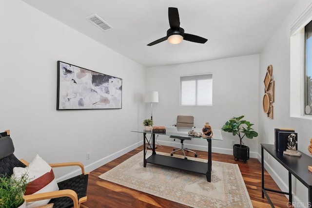 office space featuring ceiling fan, wood-type flooring, and a healthy amount of sunlight