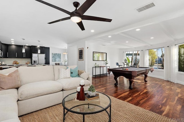 living room featuring ceiling fan, dark hardwood / wood-style flooring, pool table, and beamed ceiling