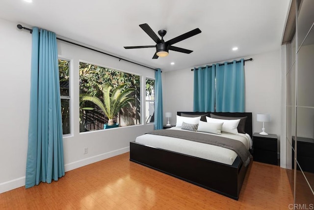 bedroom featuring ceiling fan and hardwood / wood-style floors