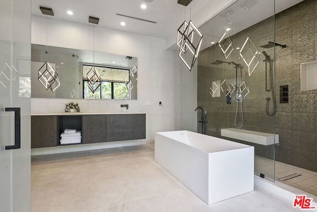 bathroom with vanity, concrete floors, and independent shower and bath