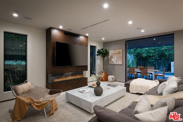 living room featuring a large fireplace