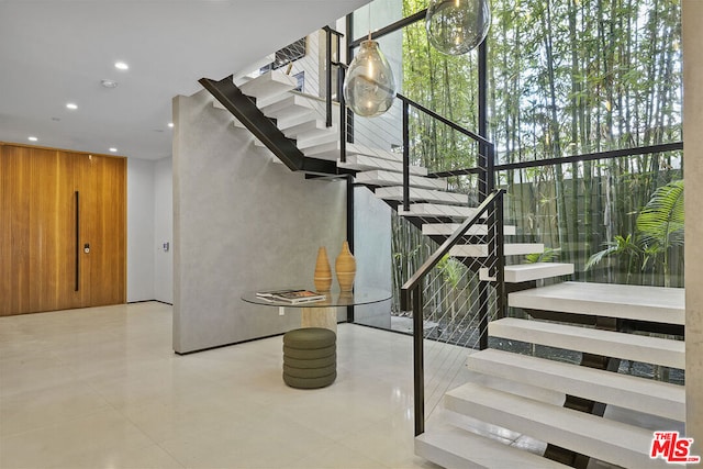 staircase with plenty of natural light