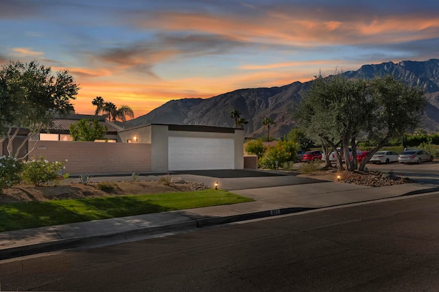 view of front of home featuring a mountain view and a garage