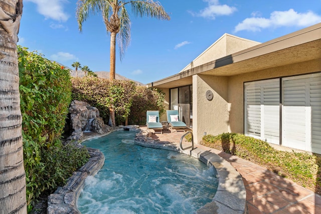 view of pool with pool water feature