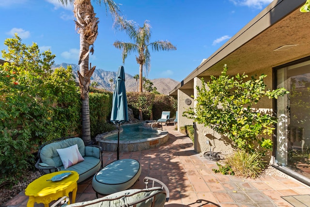 view of patio with a mountain view and an outdoor hangout area