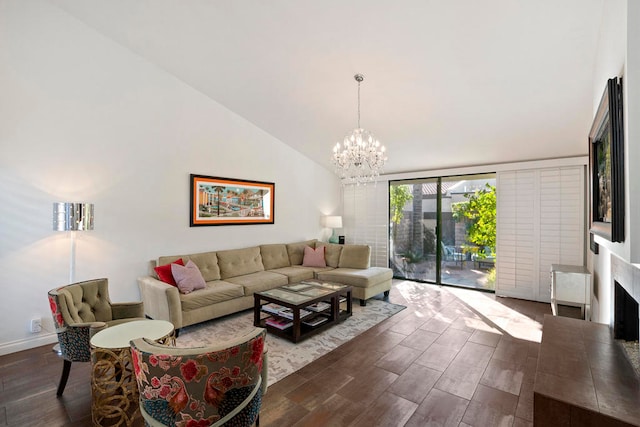 living room featuring dark wood-type flooring, high vaulted ceiling, and an inviting chandelier