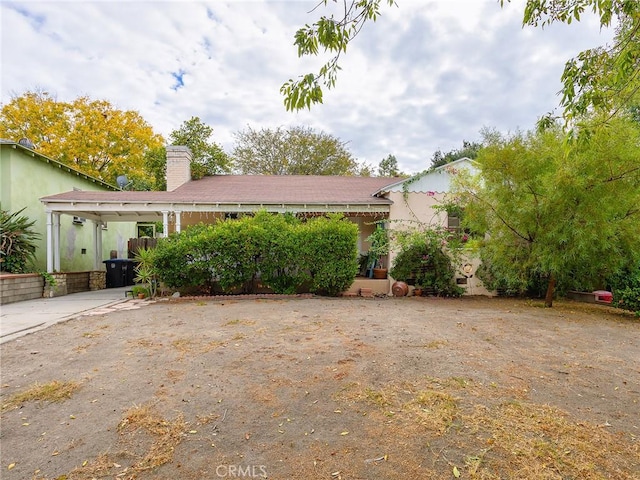 view of front of house featuring a carport