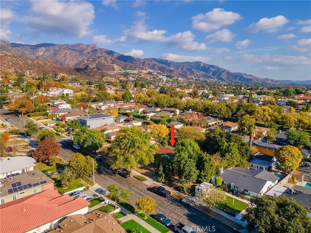 birds eye view of property featuring a mountain view