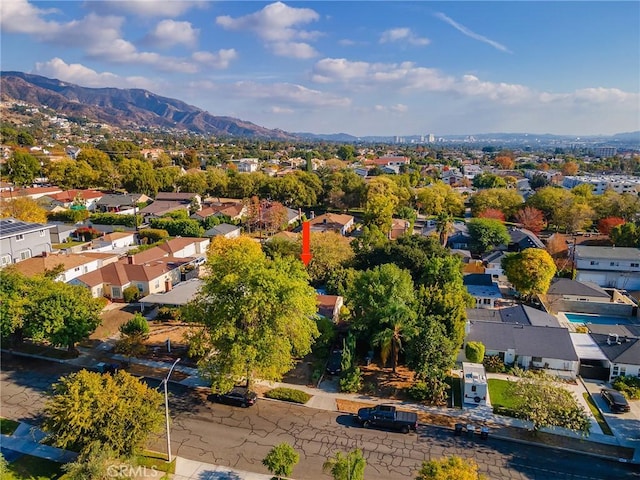 birds eye view of property with a mountain view