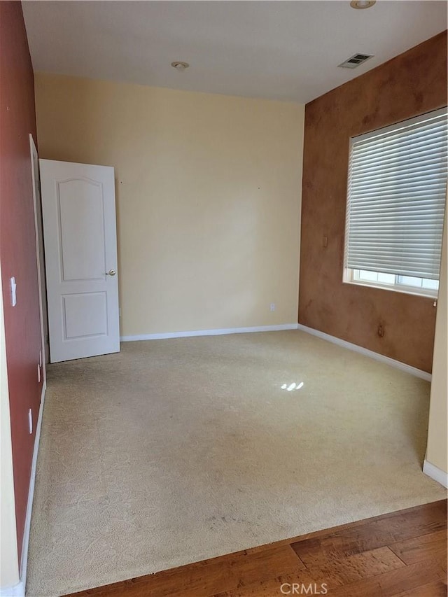 unfurnished room with light hardwood / wood-style floors