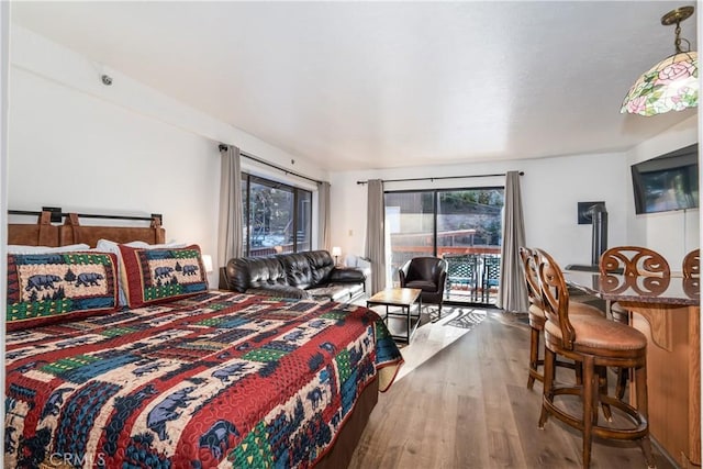 7540 Henness Cir Unit B101, Yosemite, CA 95389 - bedroom with access to exterior and wood finished floors