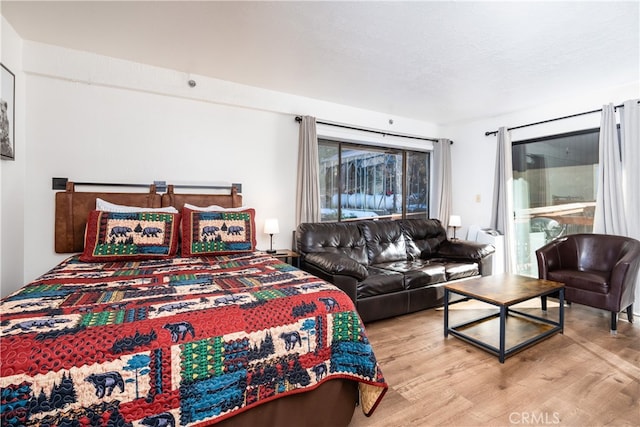 bedroom with light hardwood / wood-style flooring