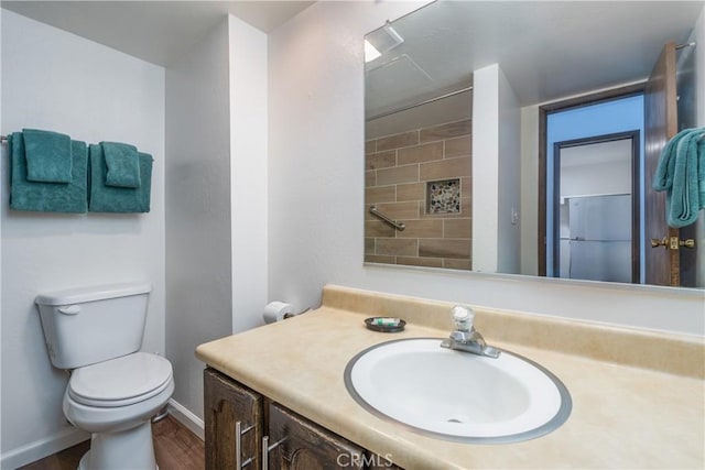 7540 Henness Cir Unit B101, Yosemite, CA 95389 - bathroom with vanity, toilet, wood finished floors, and baseboards