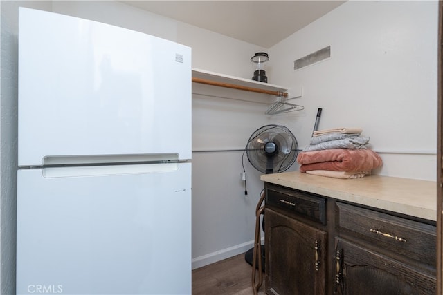 laundry room featuring dark wood-type flooring