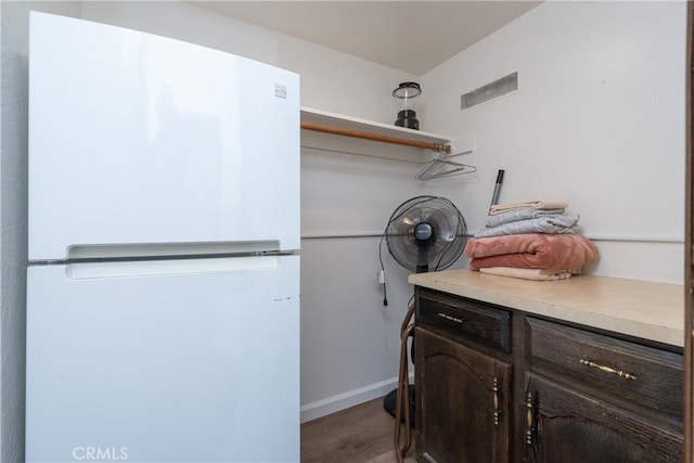 7540 Henness Cir Unit B101, Yosemite, CA 95389 - laundry room featuring wood finished floors and baseboards