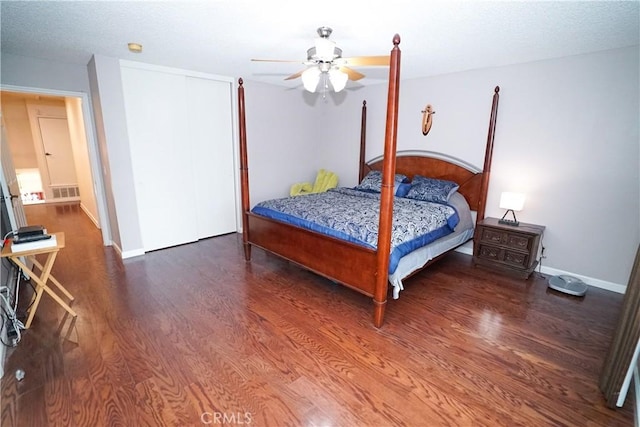 bedroom featuring ceiling fan and dark hardwood / wood-style floors