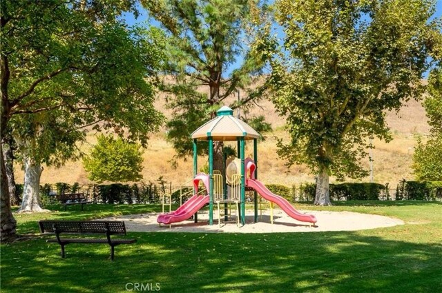 view of playground featuring a yard