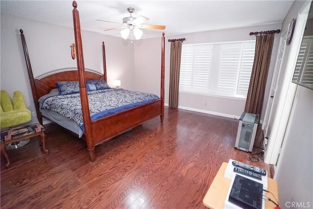 bedroom featuring dark hardwood / wood-style flooring and ceiling fan