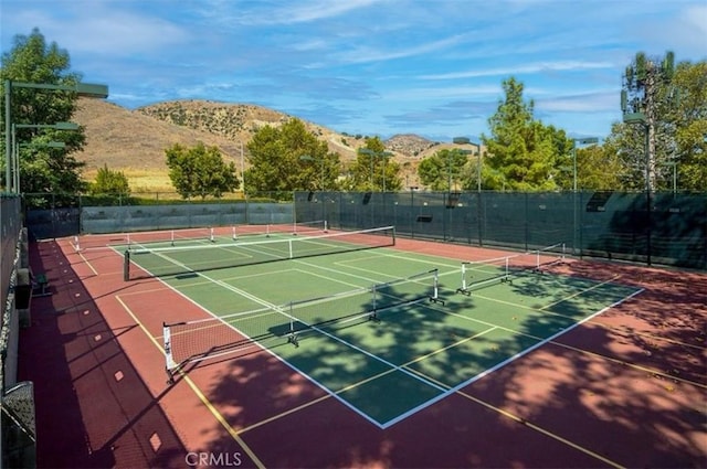 view of sport court with a mountain view