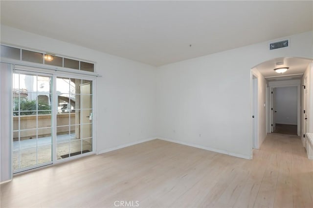 unfurnished room with light hardwood / wood-style floors