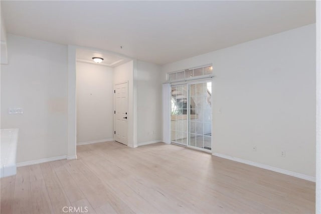 unfurnished room featuring light hardwood / wood-style floors