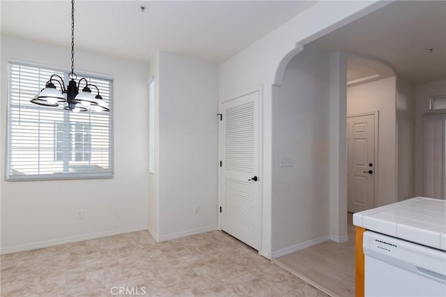 interior space featuring a chandelier