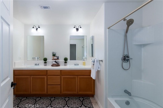 bathroom featuring tile patterned floors, vanity, and shower / bathtub combination