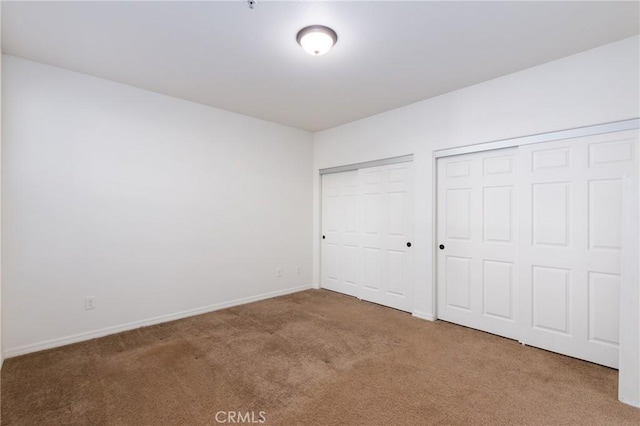 unfurnished bedroom with carpet floors