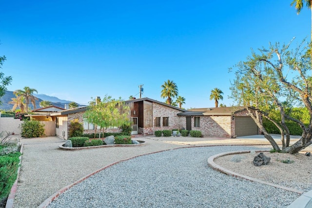 view of front of home featuring a garage and a mountain view