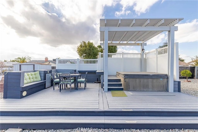 wooden deck featuring a pergola and a hot tub