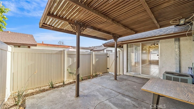 view of patio / terrace with central AC unit and a pergola