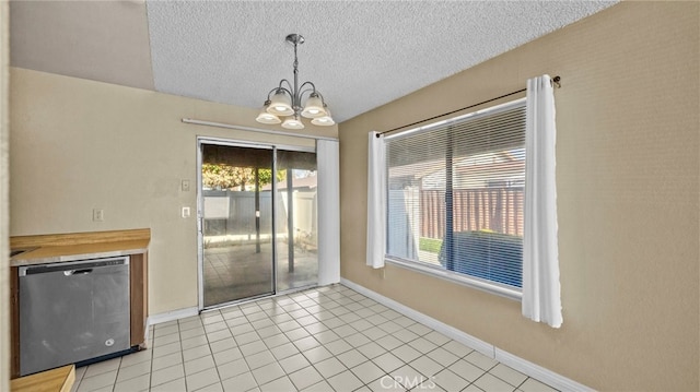 unfurnished dining area featuring a textured ceiling, light tile patterned floors, and a chandelier