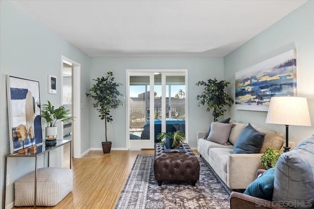 living room with light hardwood / wood-style flooring