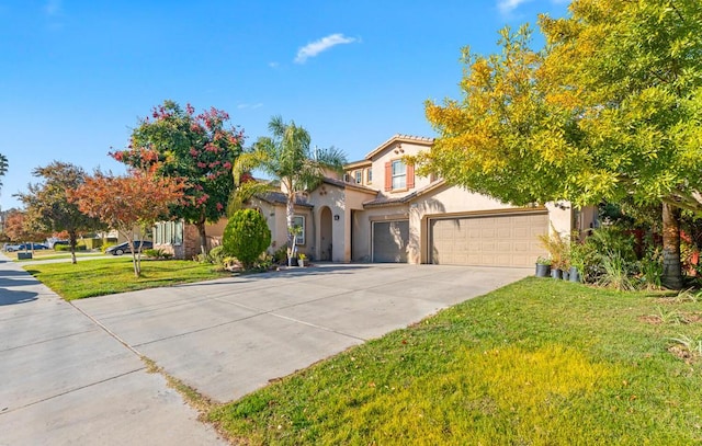 view of front of home featuring a garage and a front lawn