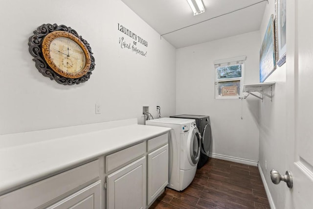 washroom featuring cabinets, dark hardwood / wood-style floors, and independent washer and dryer