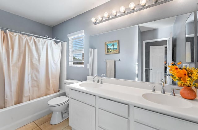 full bathroom with toilet, shower / bath combo, vanity, and tile patterned floors