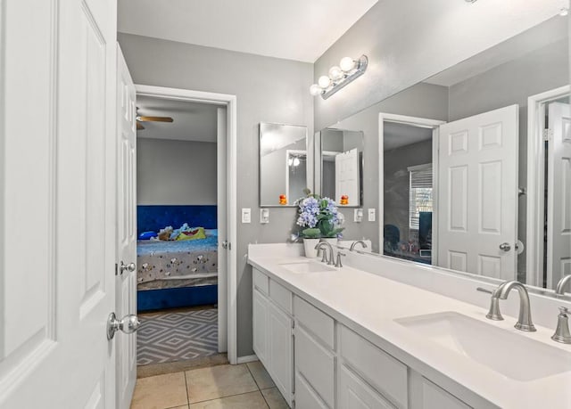 bathroom featuring tile patterned flooring, vanity, and ceiling fan