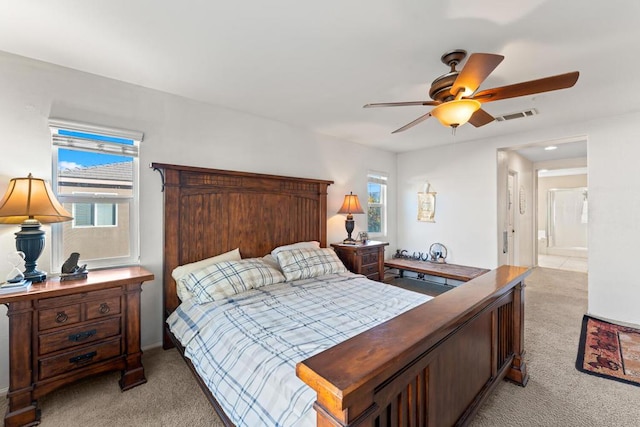 bedroom featuring ceiling fan and light carpet