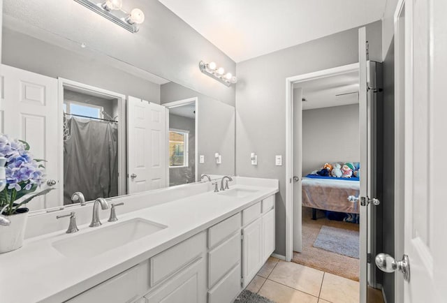 bathroom with tile patterned flooring and vanity