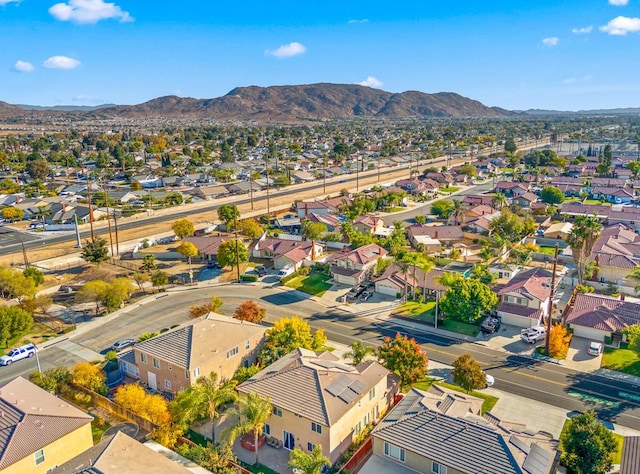 birds eye view of property featuring a mountain view