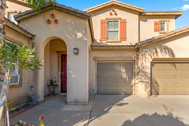 mediterranean / spanish-style house featuring a garage