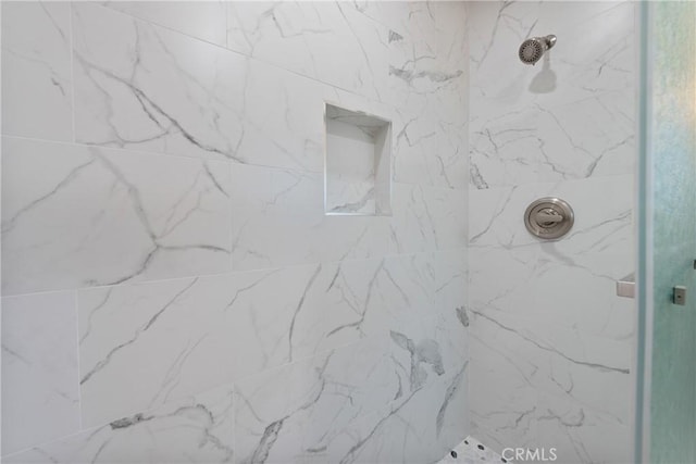 room details with a tile shower