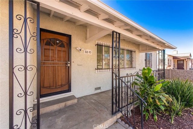 entrance to property featuring covered porch