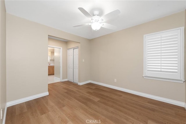 unfurnished room featuring light hardwood / wood-style flooring and ceiling fan