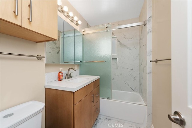 full bathroom with combined bath / shower with glass door, vanity, and toilet